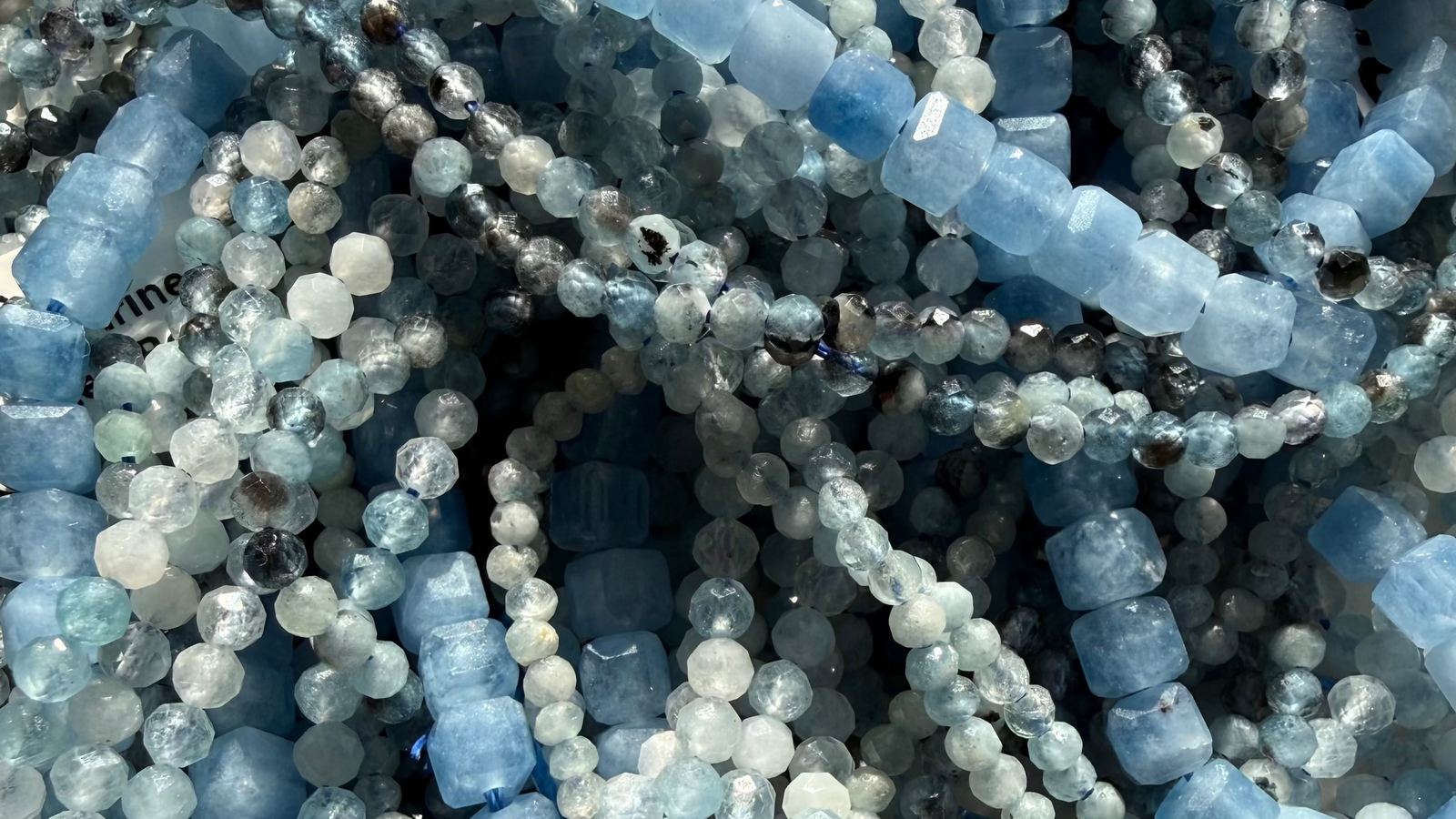 The LJ gemstone jewelry collection featuring turquoise, jade, onyx, lapis lazuli and amethyst bracelets, necklaces and anklets