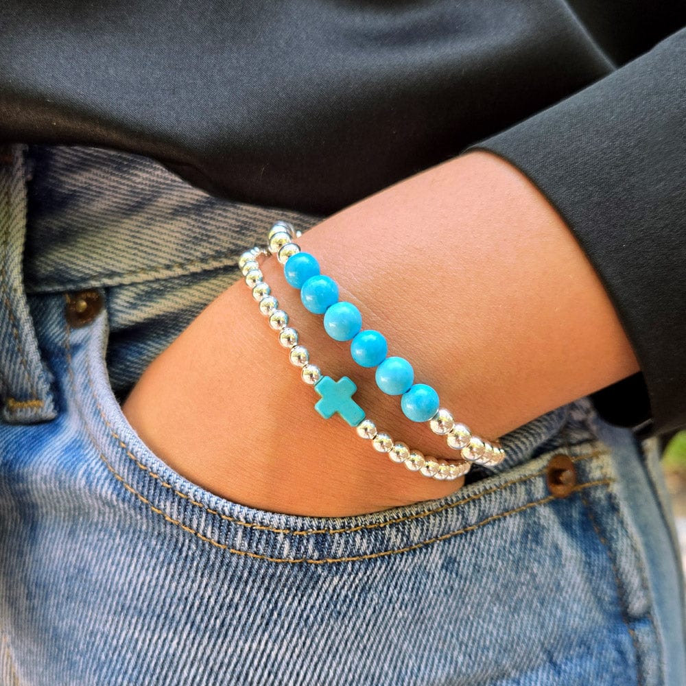 Turquoise bracelets with Sterling silver stretch beads and a turquoise cross charm