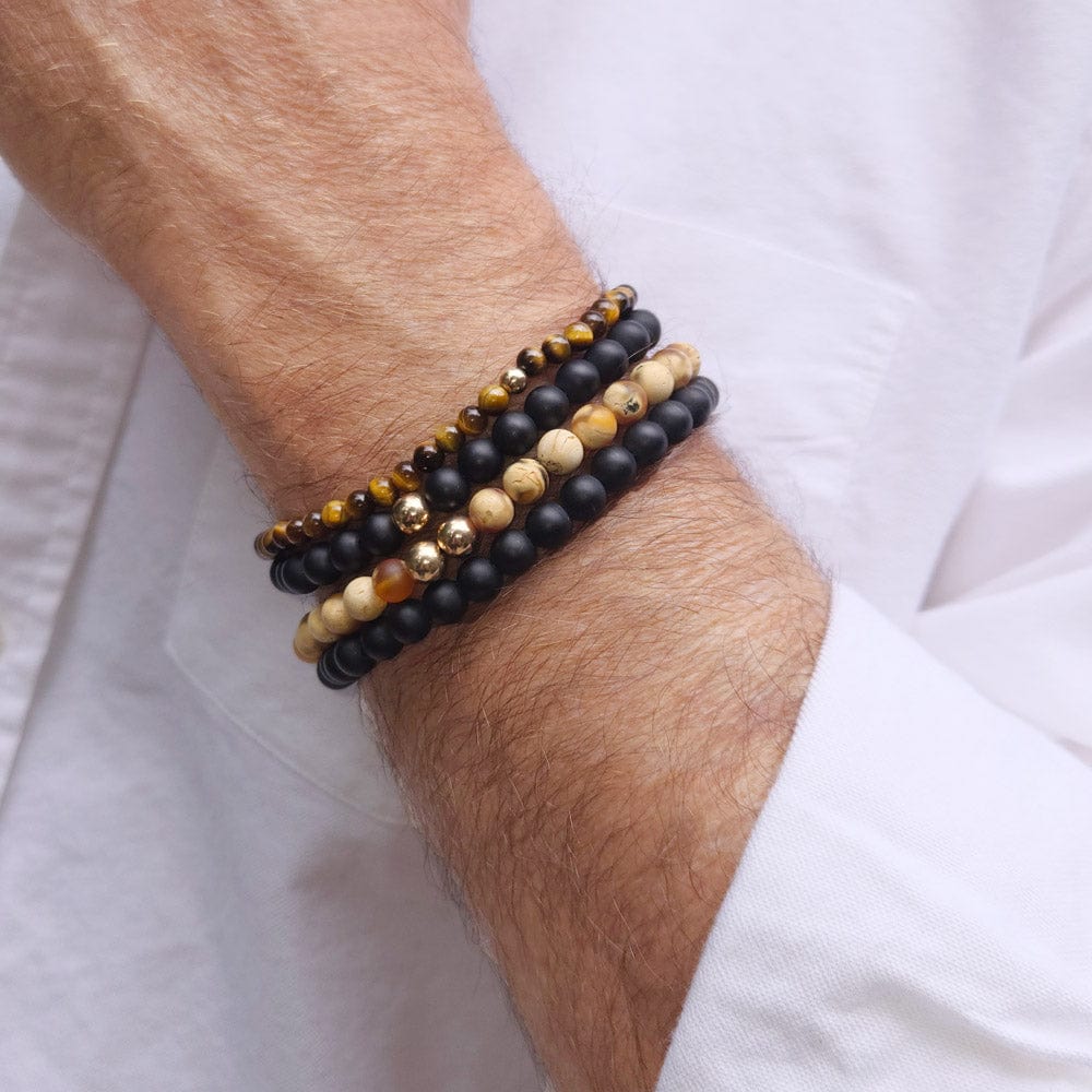 Two stacked men&#39;s black onyx beaded bracelets with two tiger&#39;s eye bracelets