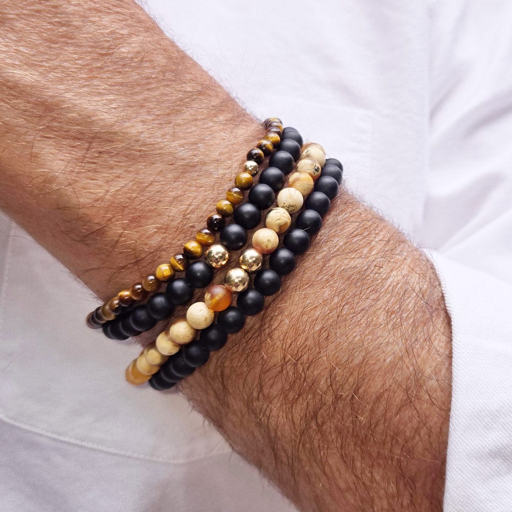 2 men&#39;s black onyx beaded bracelets stacked with 2 tiger&#39;s eye beaded bracelets