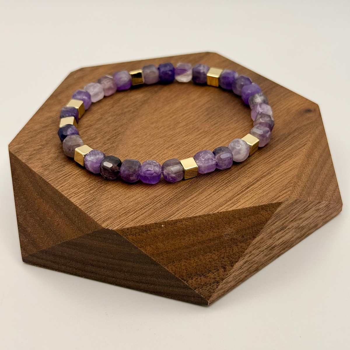 Necklace with a red heart pendant on a blurred background