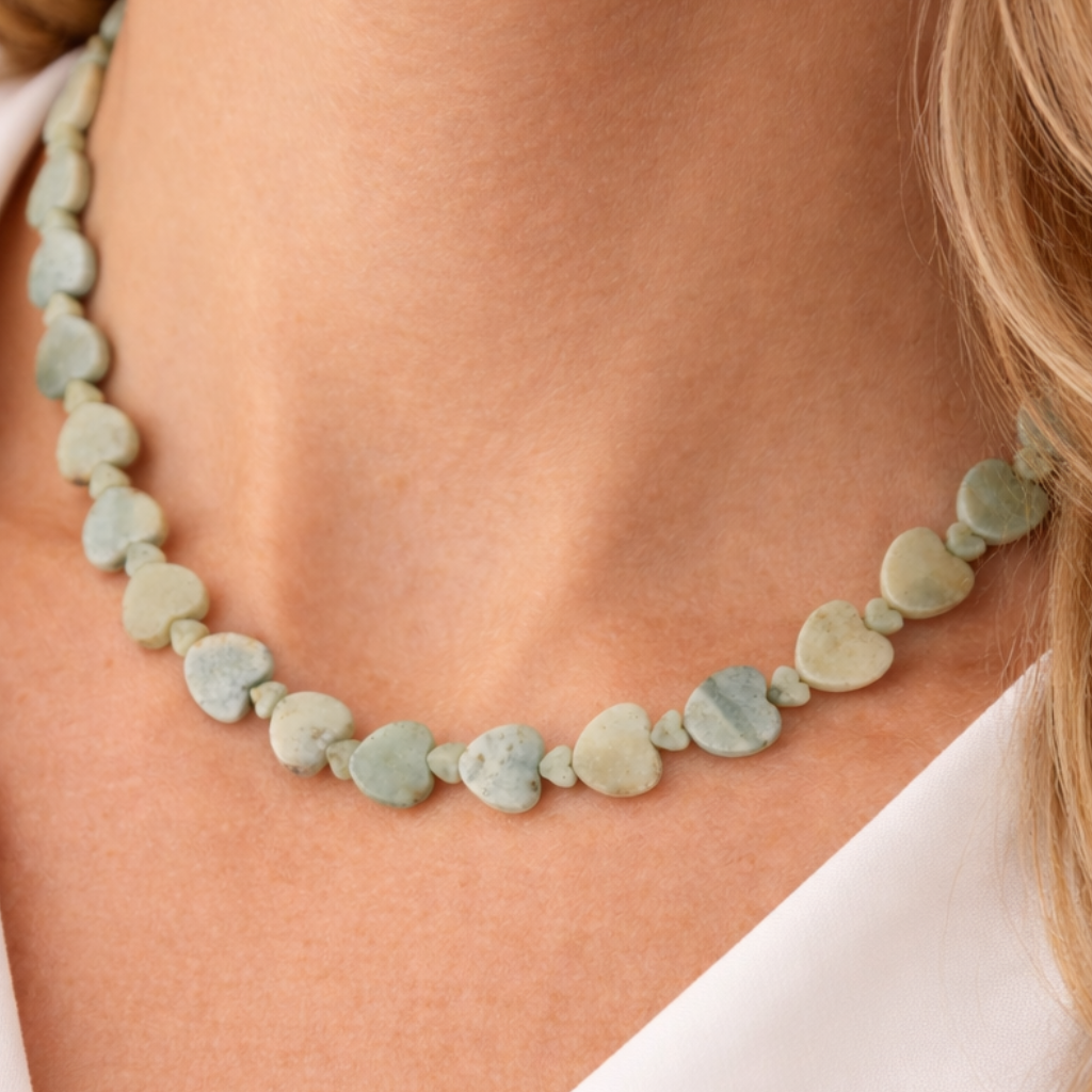 Adjustable 16 to 18 inch necklace with a mix of large and small light teal Amazonite heart-shaped gemstones and a silver clasp.