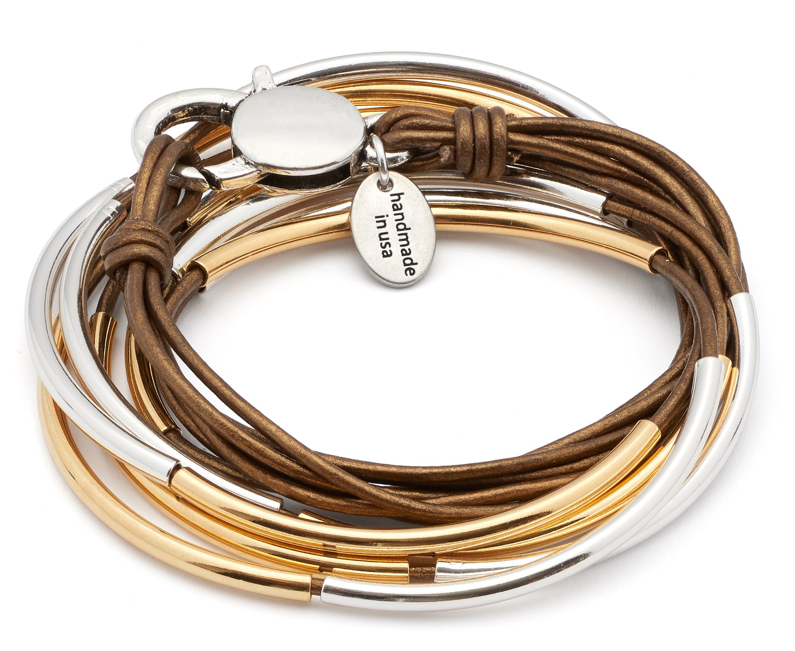 Gold bracelet on a wrist with a blurred background