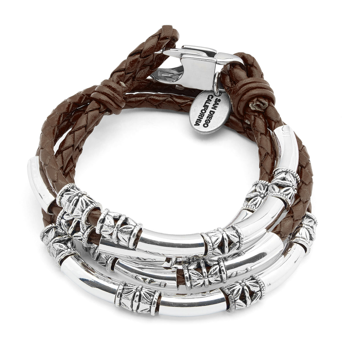 A multi-strand bracelet featuring brown braided leather cords and polished silver-tone metal tubes with textured details, shown on a plain white background. A silver tag is attached and reads 'VINTAGRAMO CATALOGO ITALY'.