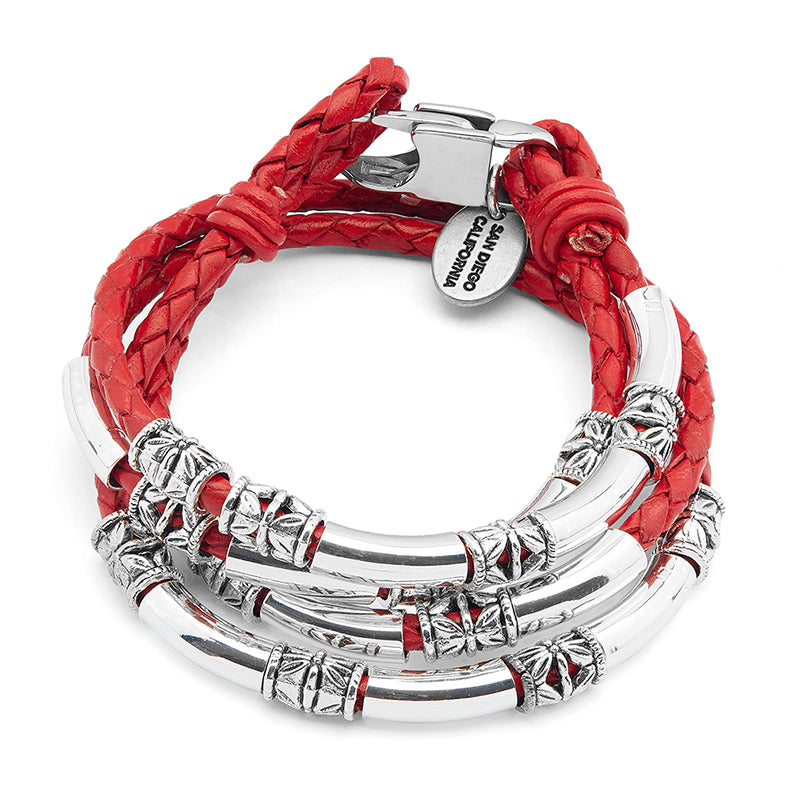 Red braided leather bracelet with silver metal accents on a white background