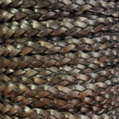 A close-up of a braided or woven brown cord with a textured, leather-like appearance.