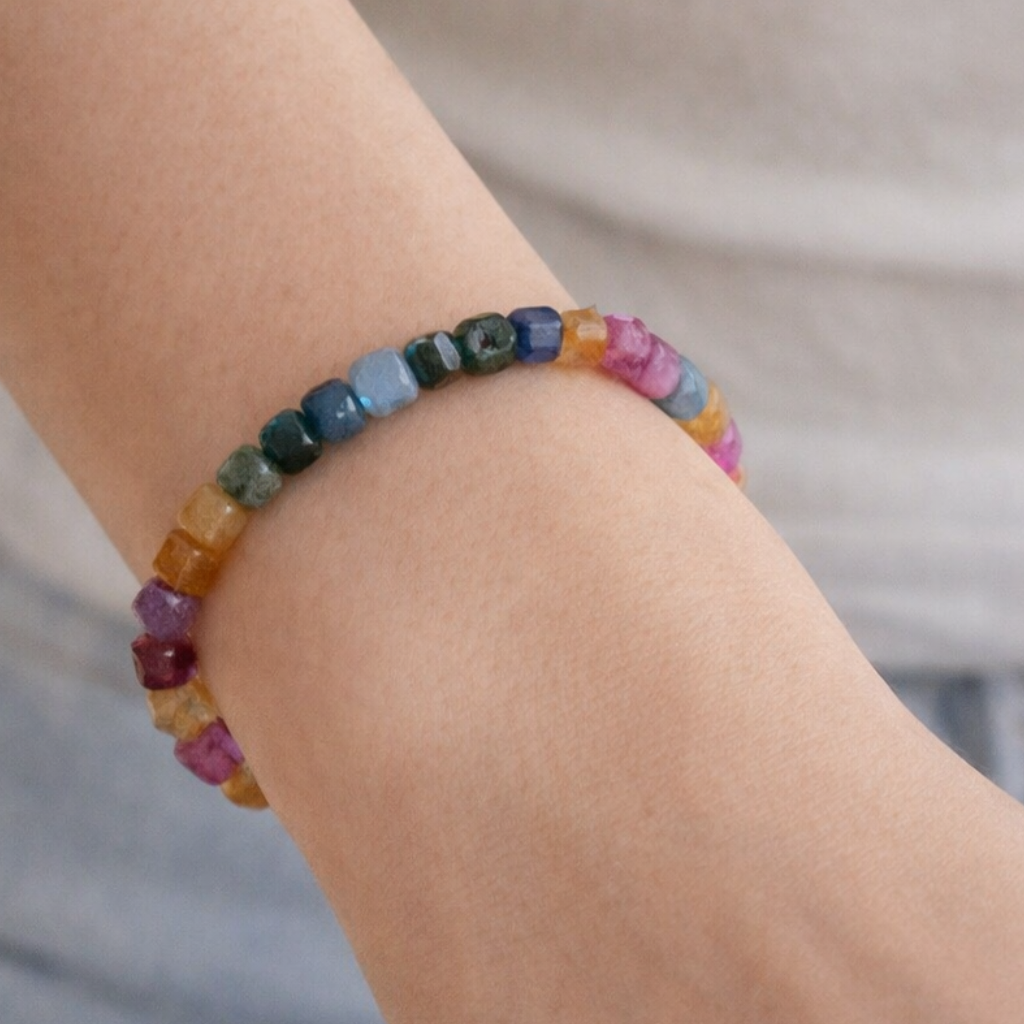 Multi-colored natural Tourmaline cube gemstone bracelet with a faceted finish and a gold-filled accent bead.