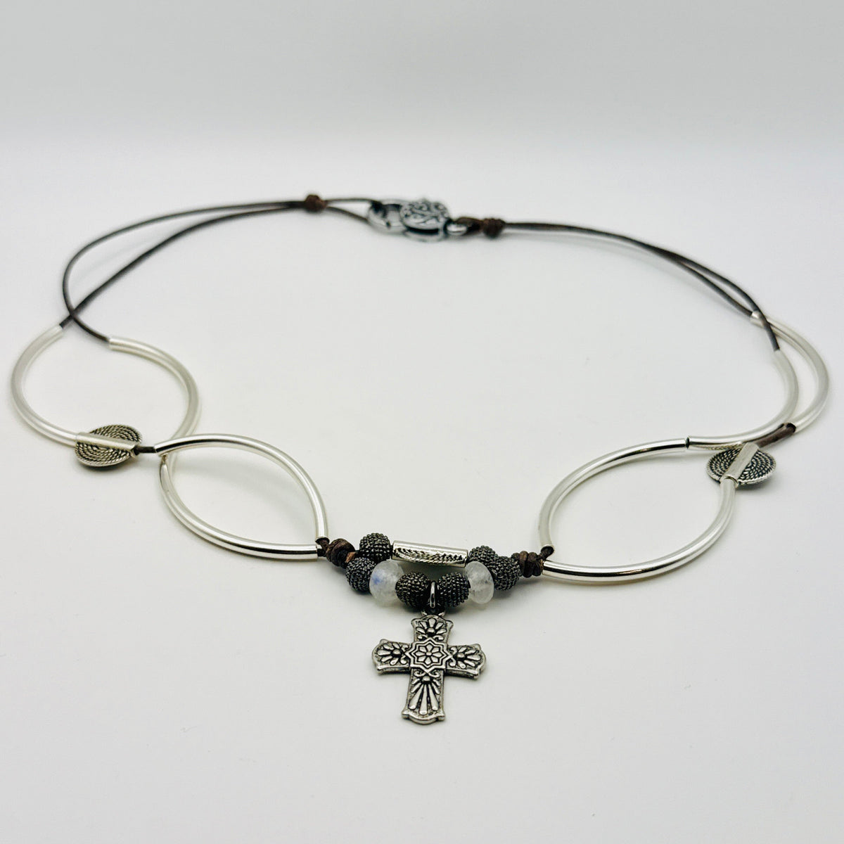 Selene convertible brown leather cross necklace with moonstone beads that wraps into a layered bracelet.