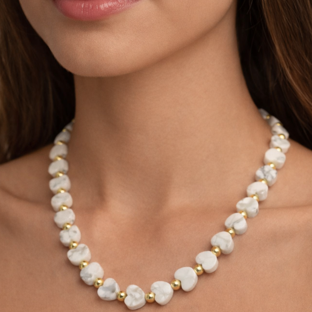 Howlite Heart Gemstone with gold filled beaded Necklace on woman's neck