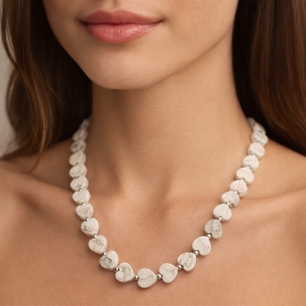 Howlite Heart Gemstone Necklace with Sterling Silver Beads around a womans neck