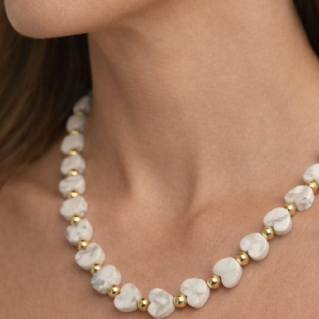 Howlite Heart Gemstone with gold filled beaded Necklace on woman's neck