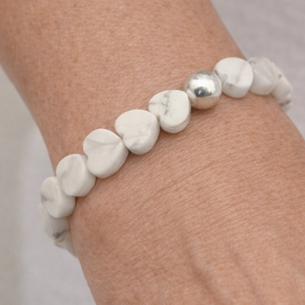 Serene howlite heart breacelet on womans writs