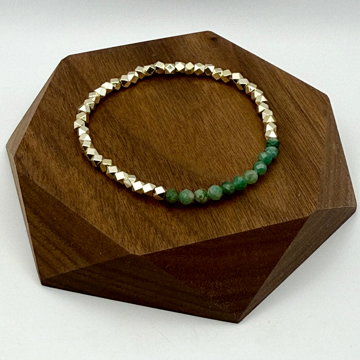 Close-up of Elowen emerald bracelet with faceted natural emerald beads and gold-filled hexagon beads