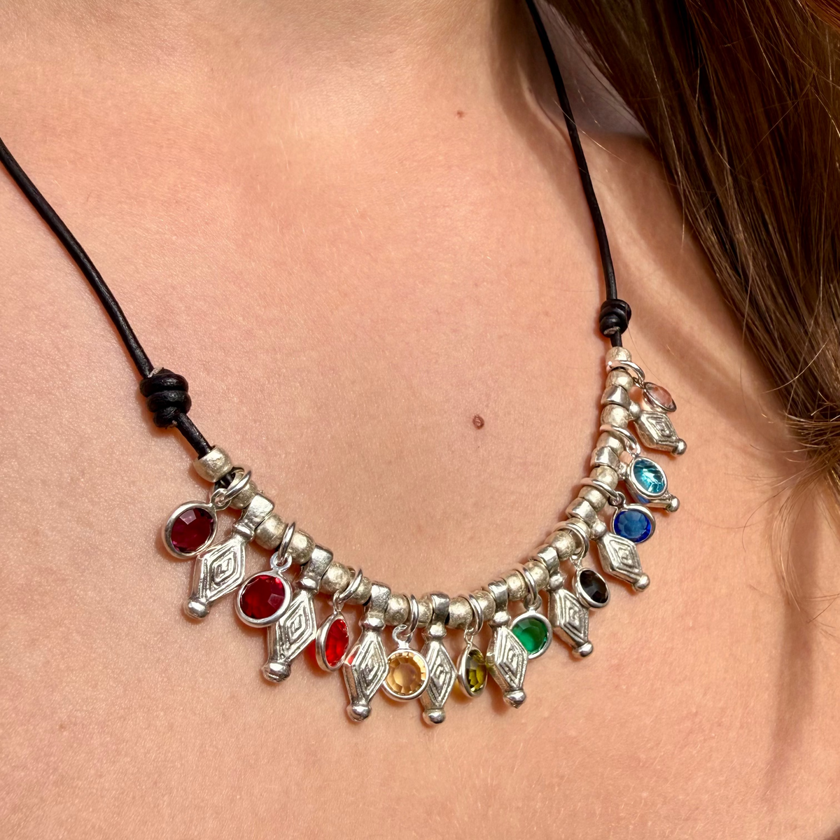 Necklace with colorful beads worn by a person