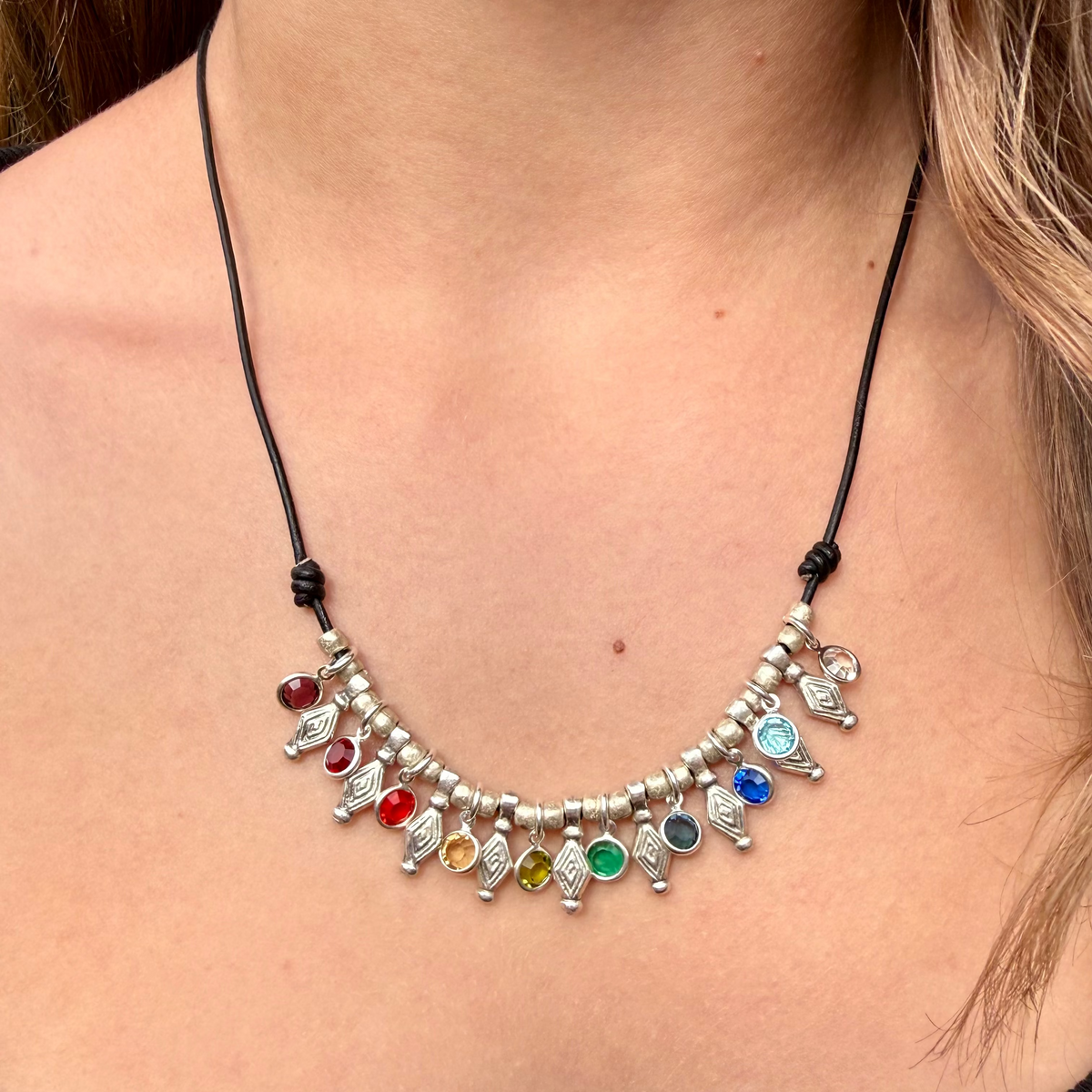 Necklace with colorful beads worn by a person