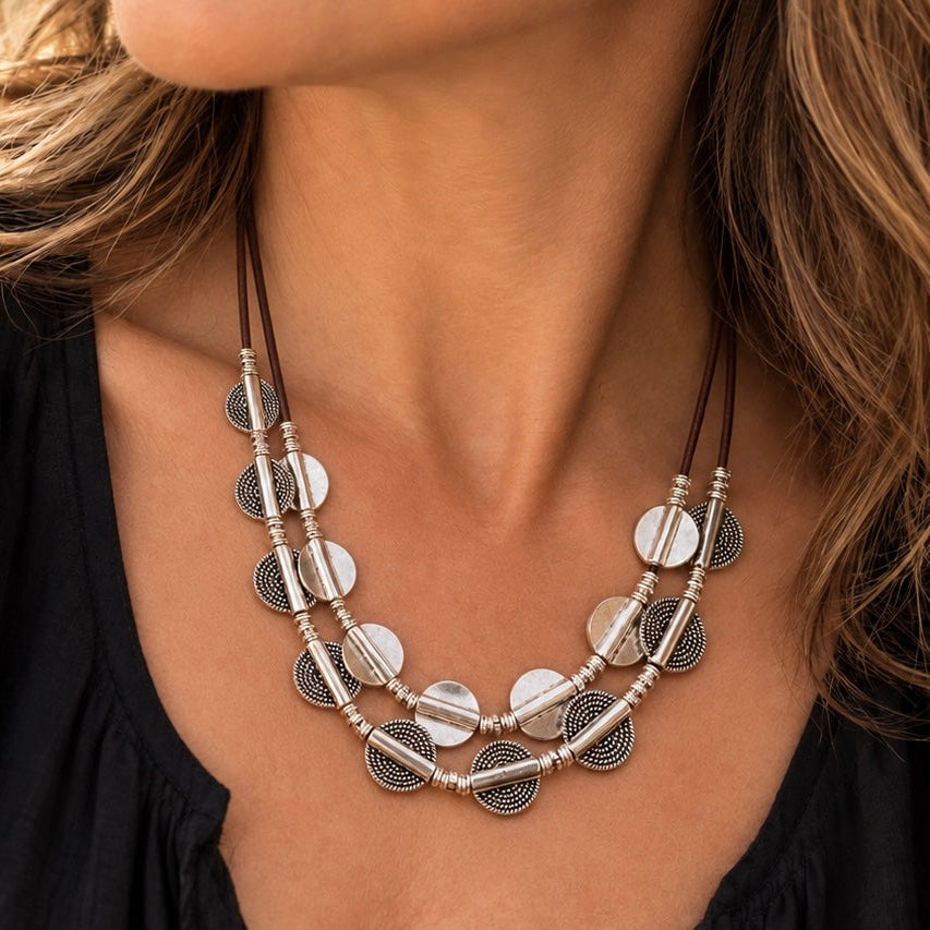 Vesper Layers two-tier leather necklace with textured hammered silver discs, smooth silver discs, and polished round beads, handcrafted in California with your choice of leather color.