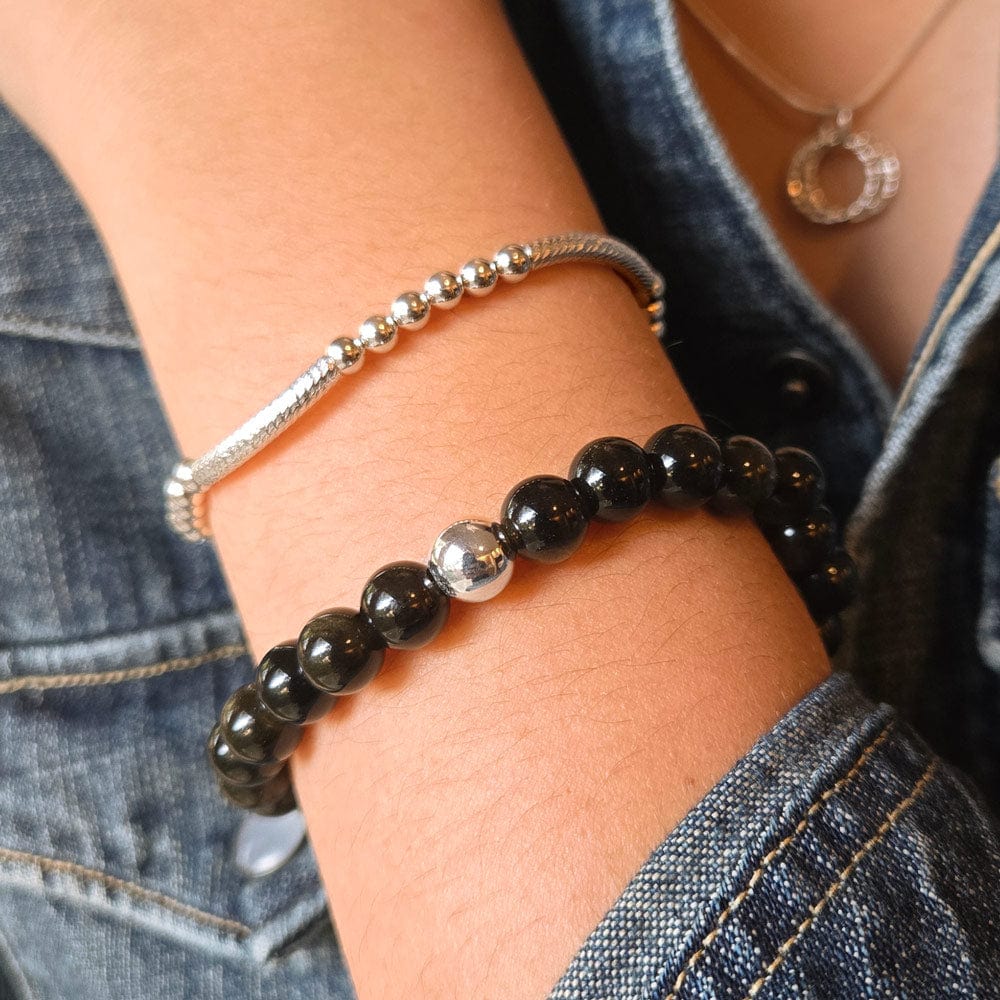 Golden Obsidian Beaded Stretch Bracelet w Sterling Silver Bead shown with the Lim Sterling silver bracelet