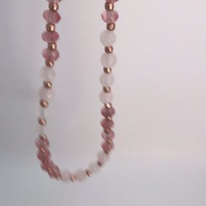 Video of the Celia Quartz Necklace featuring pink faceted cherry quartz, smooth pale rose quartz beads, and rose gold plated accents on a white background.