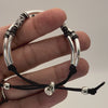 Video showing detail of the Axis Adjustable Black Leather Bracelet with Silver PLated crescents, etched silver tube beads and black hexigon beads