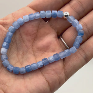 5mm faceted Aquamarine cube bracelet with sterling silver accent close-up and stretch video – March birthstone stretch bracelet handmade in California