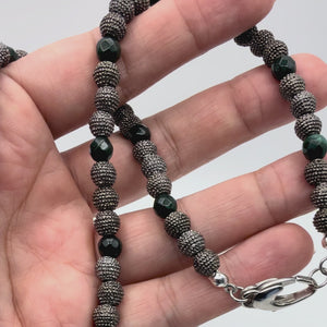 Video of the Noa Emerald Green Jade Necklace with Gunmetal & Jade beads held in a hand showing detail. 