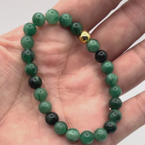 Video of the Brielle Emerald Bracelet with Natural Emerald & Gold-Filled Beads held in a hand showing the detail close-up.