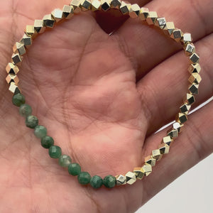 Video of the Elowen Natural Emerald Bracelet with Gold-Filled beads held in a hand showing the detail. 
