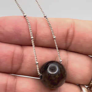 Polished 14.5 mm Herkimer diamond quartz bead on a dainty vintage silver plate satelite bead chain held in-hand