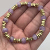 Shop The Lilac Mist Bracelet. Features 8mm faceted lavender amethyst rondelles with elegant satin-finish gold square accents. A waterproof, easy-on stretch-to-fit bracelet handmade in the USA. Perfect for everyday elegance.