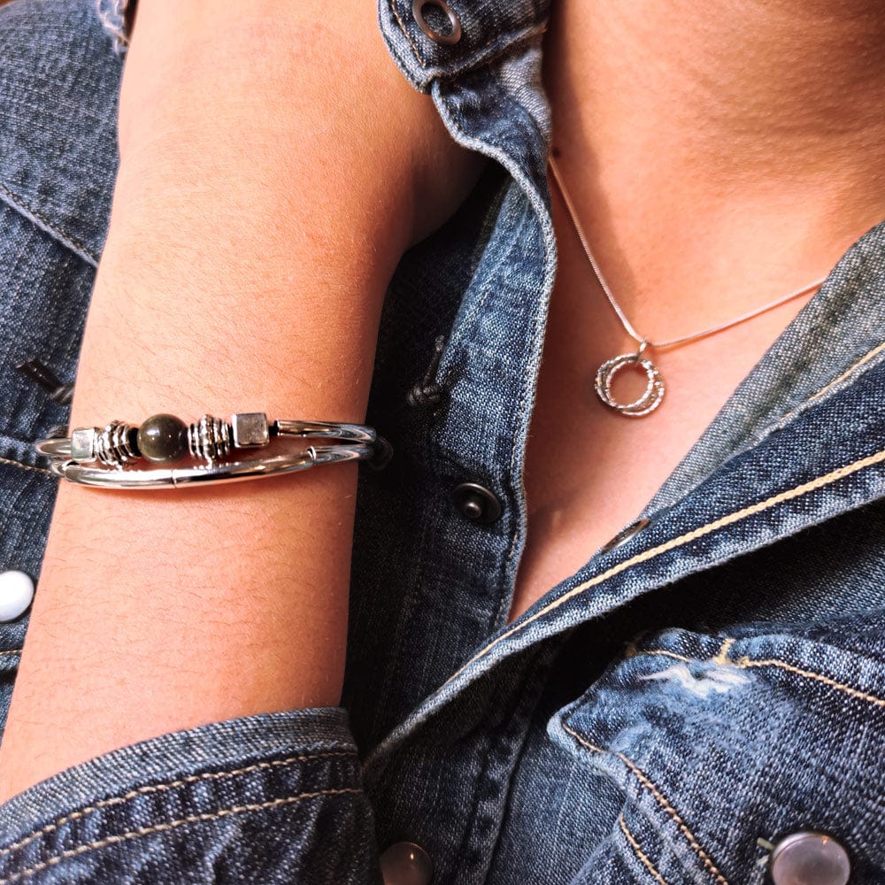 Sofi Adjustable Black Leather Bracelet with Silver Plated Crescents &amp; Gold Obsidian Focal, also shown the Sterling Silver Quad Circle necklace