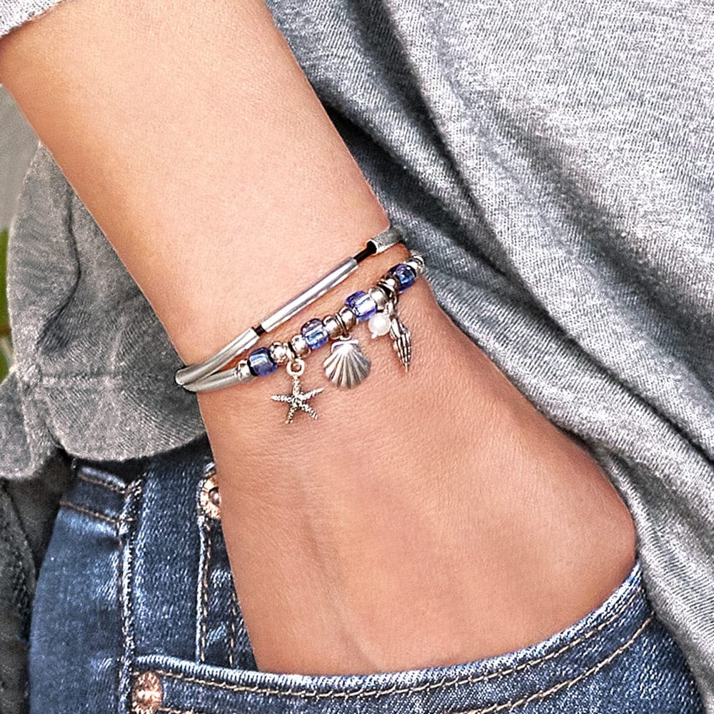 Surfside silver adjustable bracelet with starfish charms, pearl, turret, and shell charms
