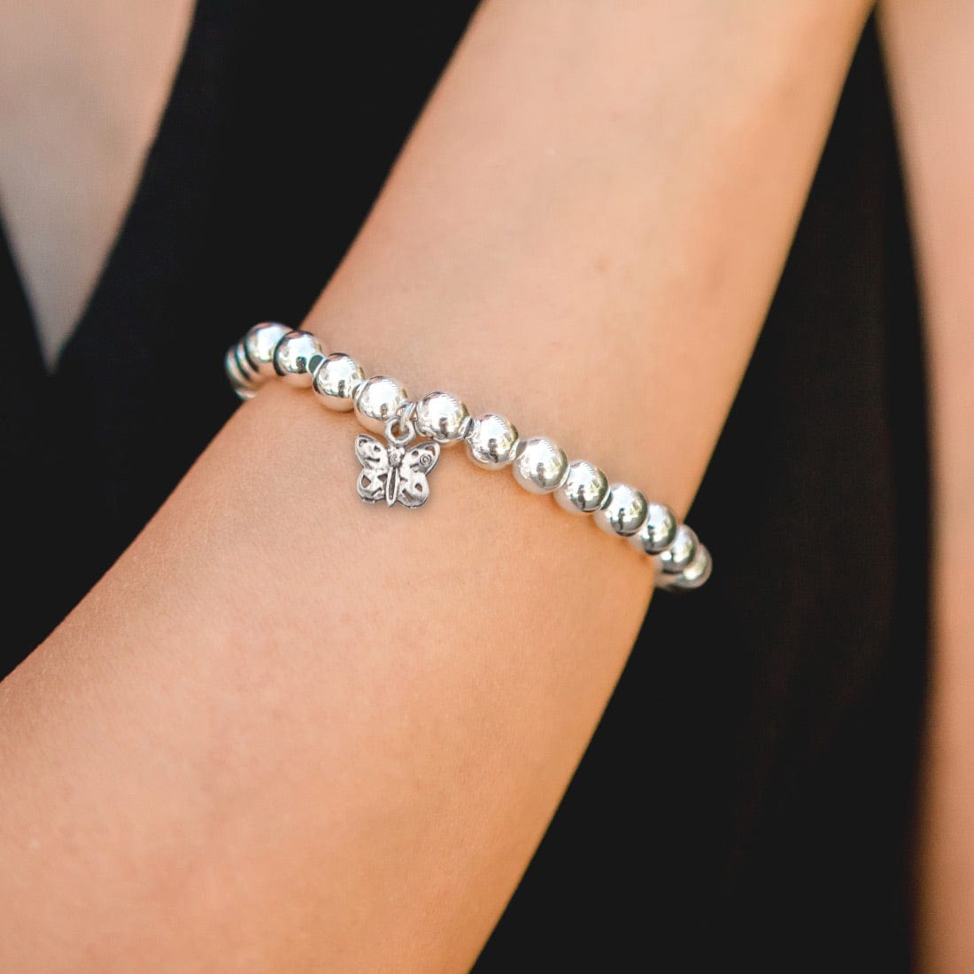 Petite silver butterfly charm